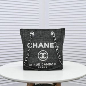 Stylish black canvas and leather tote showcasing the Chanel Replica Deauville Chain Tote Bag C74.