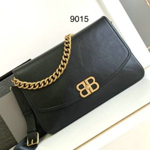 shop Balenciaga Replica BB Soft Large Flap Bag in classic black with a stunning gold chain. available on sake